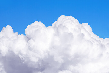 A large white cloud against a blue sky.