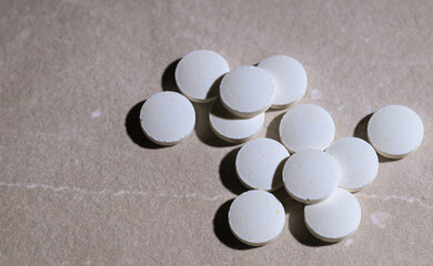 Close up of White weight Loss Pills on Stone Countertop