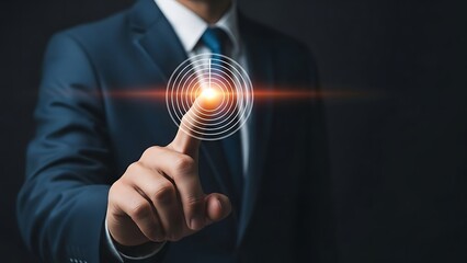 Businessman in blue suit touching glowing orange circle with finger  futuristic technology concept