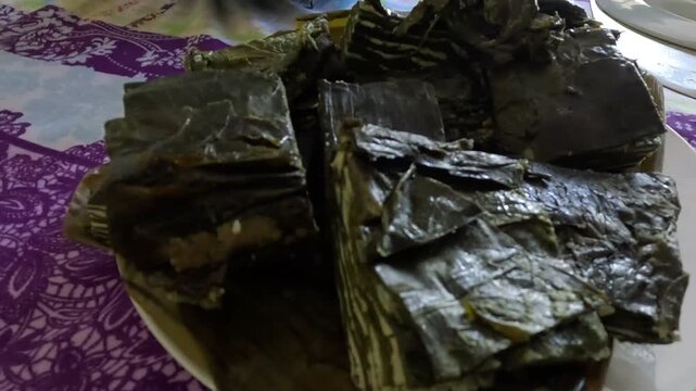 Slippery cabbage leaves cooked in an earth oven.