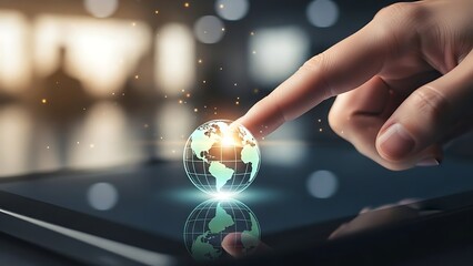 hand touching a glowing 3D earth globe on a tablet screen with blurred background