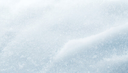 Obraz premium Close Up Of Sparkling Snow Texture With Soft Blue Gradient And Bright Light Reflections