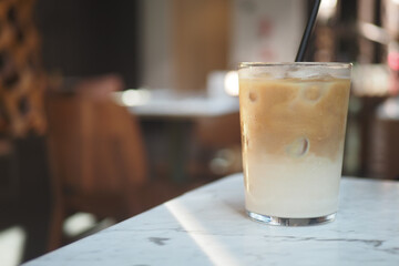 Iced coffee drink on a table in a cafe