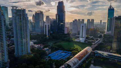 Scenic landscape of Jakarta cityscape at sunset with beautiful architecture and infrastructure. Indonesia aerial scenery