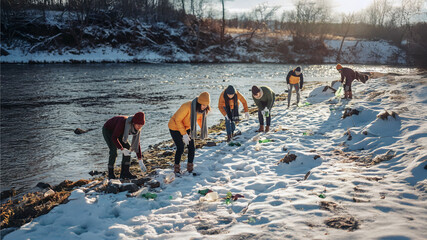 Environmental awareness scene, volunteers cleaning a snowy riverbank, winter nature, photorealistic, January 2026, community activity.