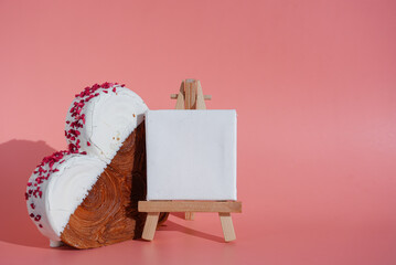 Empty paper note template sample mock up blank for wishes greeting holiday card Heartshaped pastry croissant treat topped with colorful frosting galore. Food experimentation viral dessert creative