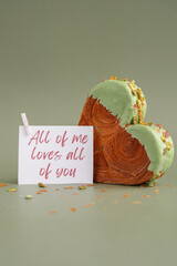 ALL OF ME LOVES ALL OF YOU Valentine's day greeting card Delightful and vibrant heartshaped pastry croissant treat, beautifully topped with colorful frosting nut galore. Mock up template copy space