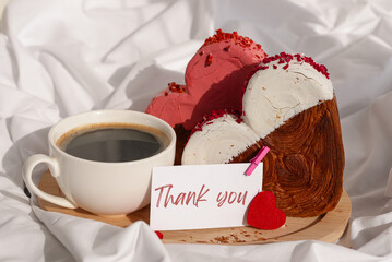 THANK YOU caption on paper note thanksgiving Morning breakfast in bed in wooden tray Present gift idea Valentine's Day Holiday celebration Heart shaped croissants. Puff pastry new trendy sweet dessert