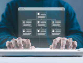 Business professional typing on keyboard with digital organization chart interface corporate hierarchy and HR management concept team structure employee data, workflow and modern enterprise technology