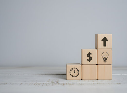 Wooden blocks with business and growth symbols - Powered by Adobe
