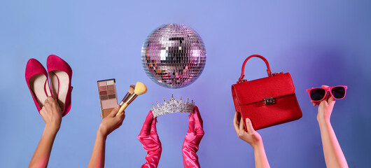 Female hands with tiara, accessories and disco ball on color background
