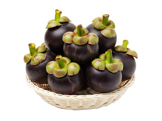Mangosteen fruit on a woven bowl, white background isolated