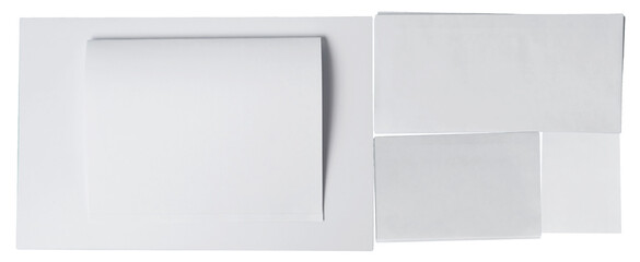 a composition of white paper sheets arranged in a visually appealing layout on a plain white background.