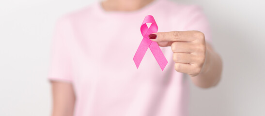 Pink October Breast Cancer Awareness month, woman with pink Ribbon for concepts of support people life and illness. National cancer survivors month, Women Health day and February World cancer day