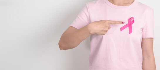 Pink October Breast Cancer Awareness month, woman with pink Ribbon for concepts of support people life and illness. National cancer survivors month, Women Health day and February World cancer day
