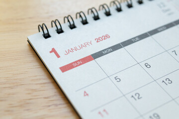 January 2026 calendar page on wooden desk for planning and new year goals
