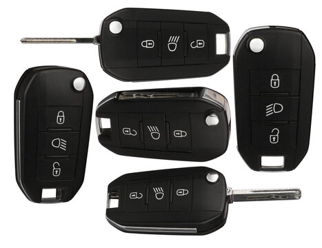 collection of five modern car key fobs with remote control buttons, presented from various angles against a transparent background for automotive services.