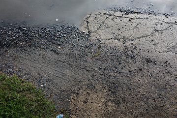 Rain Puddles On Concrete Ground.