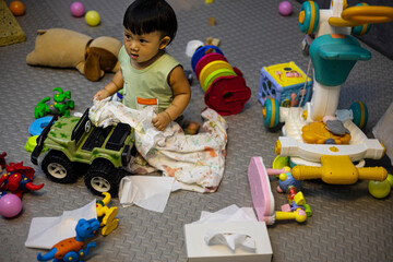 Toddlers Playing In A Very Messy Living Room.