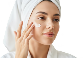 Woman applying cream on face isolated on transparent background after taking shower