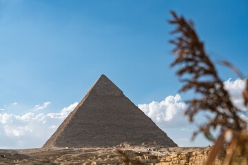 A stunning view of the Great Pyramid of Giza in Egypt, displaying its majestic structure under a...