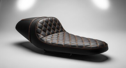 Obraz premium Custom upholstered motorcycle saddle features diamond stitching detail in a setting