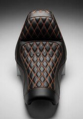 Obraz premium Black cushioned transportation seat displays intricate diamond pattern contrast stitching