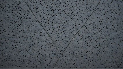 Porous Dark Volcanic Rock Texture - Gray Basalt Stone Surface with Small Holes for Natural Zen Architecture Background
