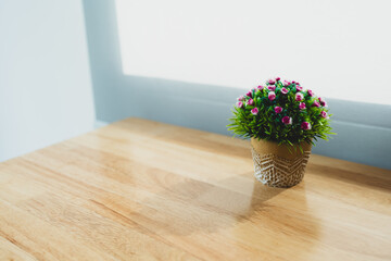Minimal artificial flower bouquet vase on wood table