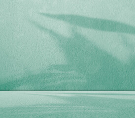 Green background light shadow leaves abstract nature on blur wall cement podium loft product, studio room floor organic minimal wallpaper backdrop summer tropical platform sale interior empty scene