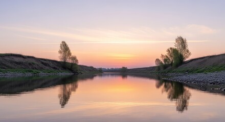 Serene river landscape at sunset with trees and calm water