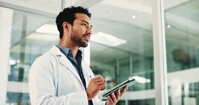 Thinking, doctor and man in hospital, tablet and planning for healthcare report. Medical service, professional and person in clinic, solution or vision for future, thought and decision for schedule