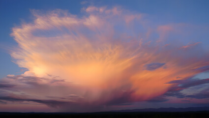 Fototapeta premium Vibrant cloud formation at sunset with orange and pink hues