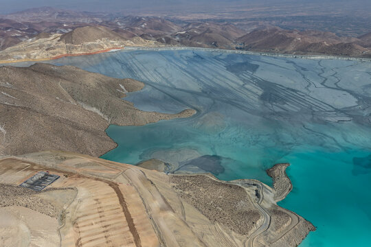 Panoramic view of a mining tailings dam with a huge reservoir in the process of consolidation