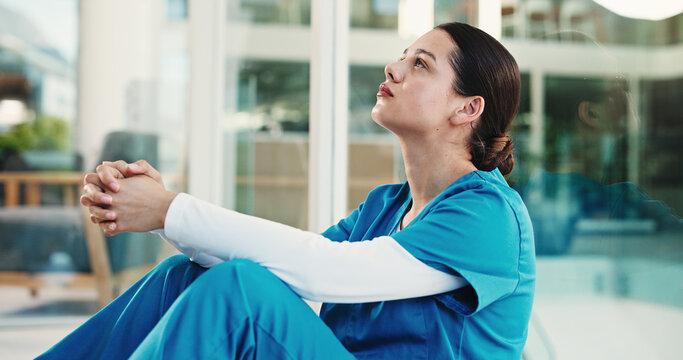 Doctor, grief and woman in hospital, thinking and regret for operation failure, sad or mental health. Unhappy, surgeon and person with depression for loss, reflection and guilt for medical error