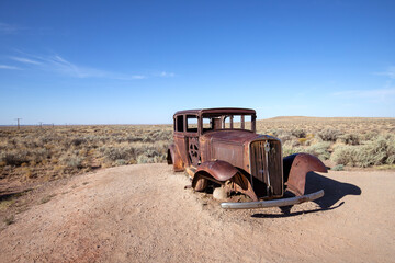 Rusty vintage automobile on the historic Route 66 in Petrified Forest National Park, Arizona