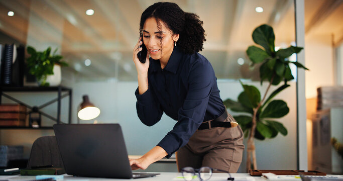 Happy woman, laptop and night with phone call for proposal, deadline or negotiation in office. Female person, consultant or agent working late with computer or mobile smartphone for business advice