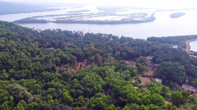 Aerial view of prawn farming ponds along the coastline, showcasing aquaculture and sustainable food production in Karnataka.