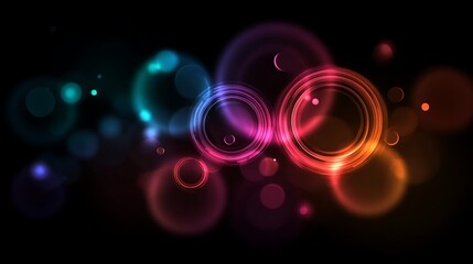 Abstract futuristic background with glowing neon circles and bokeh light effects on black
