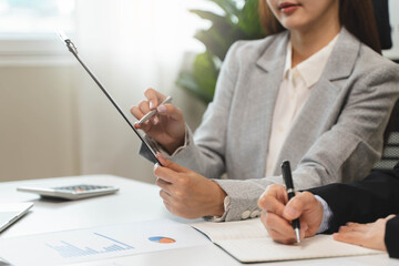 Financial consult planning investor asses and present to client, Close up shot client and advisor...