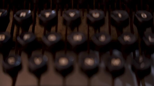Super slow motion of the keys of an old typewriter. Vintage. 100 fps
