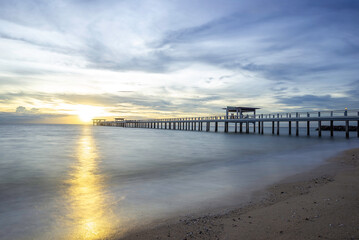 Obraz premium Summer, Travel, Vacation and Holiday concept - Wooden pier between sunset in Phuket, Thailand