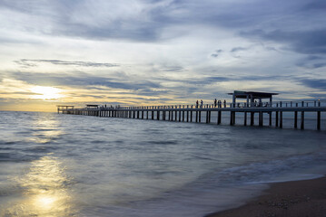 Obraz premium Summer, Travel, Vacation and Holiday concept - Wooden pier between sunset in Phuket, Thailand