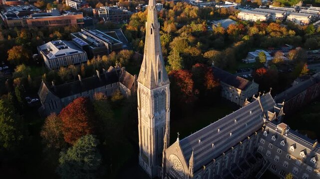 Amazing drone spiral over Old Church tower in Maynooth university, reveal of Sun. Ireland