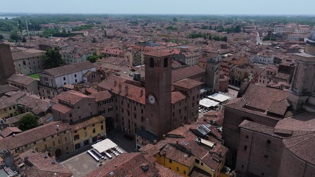 sliding right to left aerial in Mantua Italy, starting from the Basilica di Sant'Andrea to Piazza delle Erbe