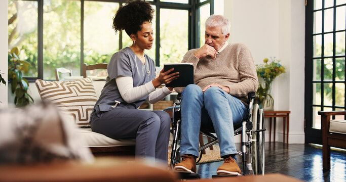 Tablet, reading and wheelchair with old man and nurse for healthcare report, support or recovery plan. Online medical review, consulting or rehabilitation with senior person with a disability in home