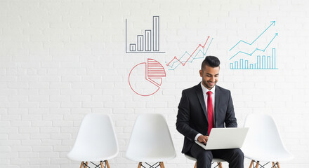 Smiling Man Analyzing Business Growth with Digital Charts