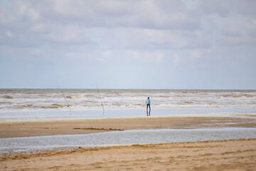Woman by the sea in winter.