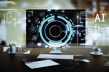 Modern desktop computer on dark office desk with futuristic AI interface, circular HUD graphics and data icons, representing artificial intelligence, machine learning and innovation

