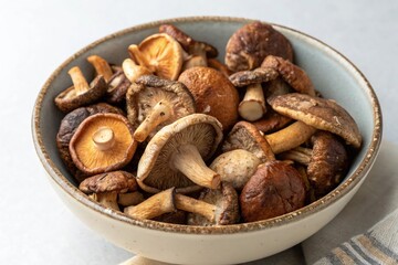 Fototapeta premium A bowl of mushrooms is on a table